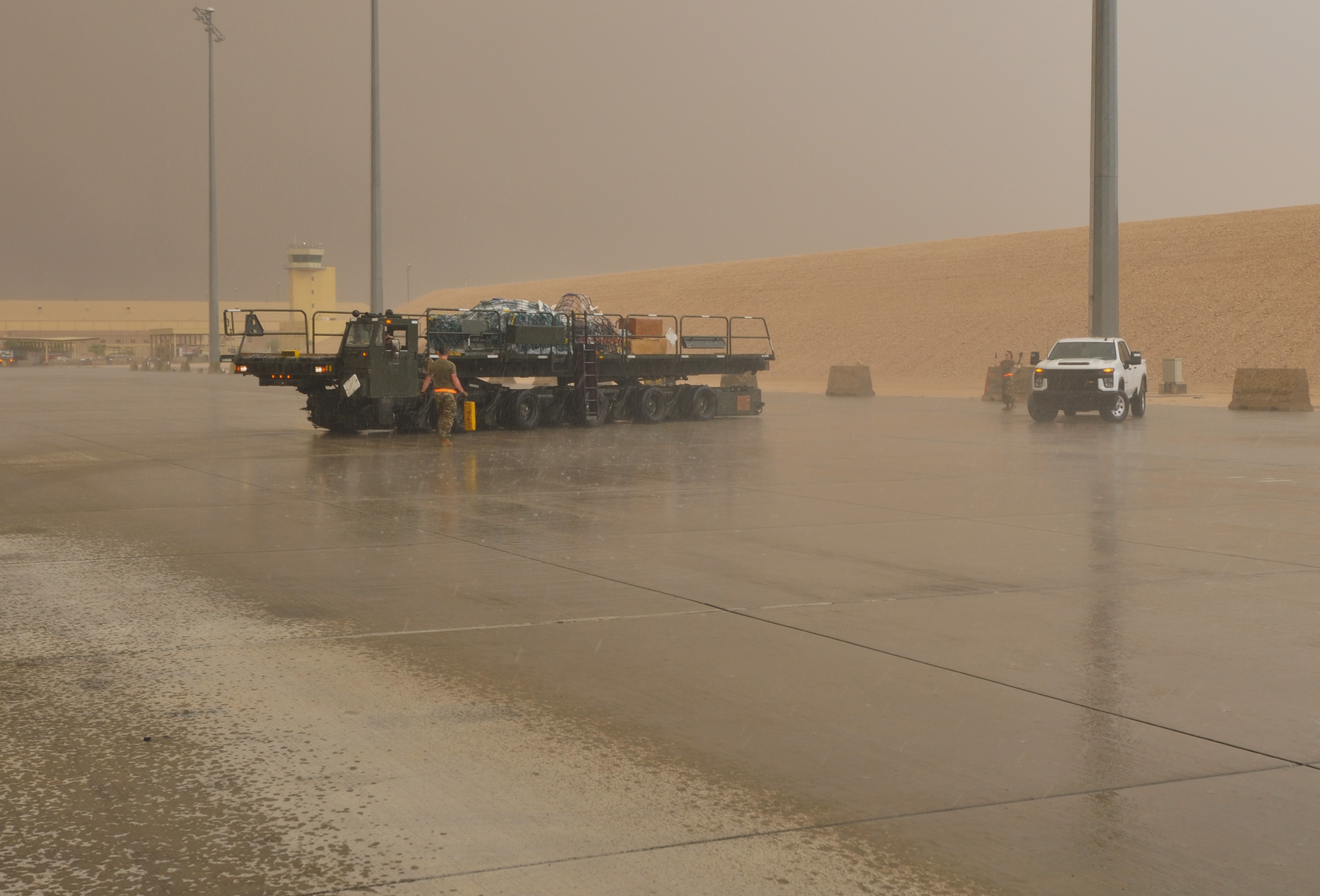 Photo - Unloading ops in a desert thunderstorm-credit RAF
